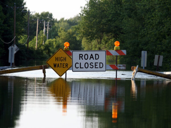 Flooding with Road Closed Sign
