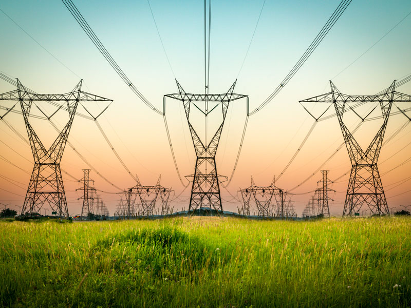 electrical grid towers in summer