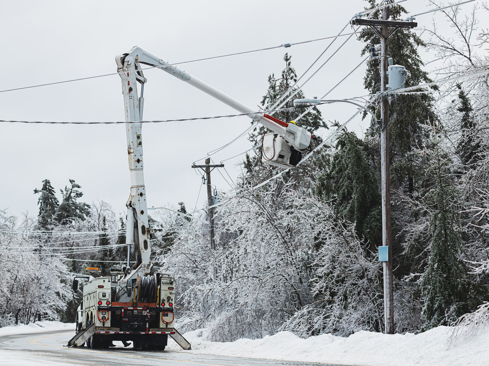 Servicing Power Lines Ice Storm