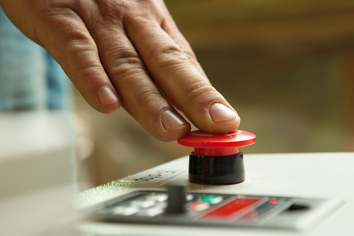 Hand Pressing Power Button