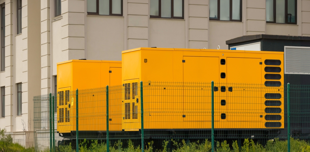 Two large generators being used to power a nearby building